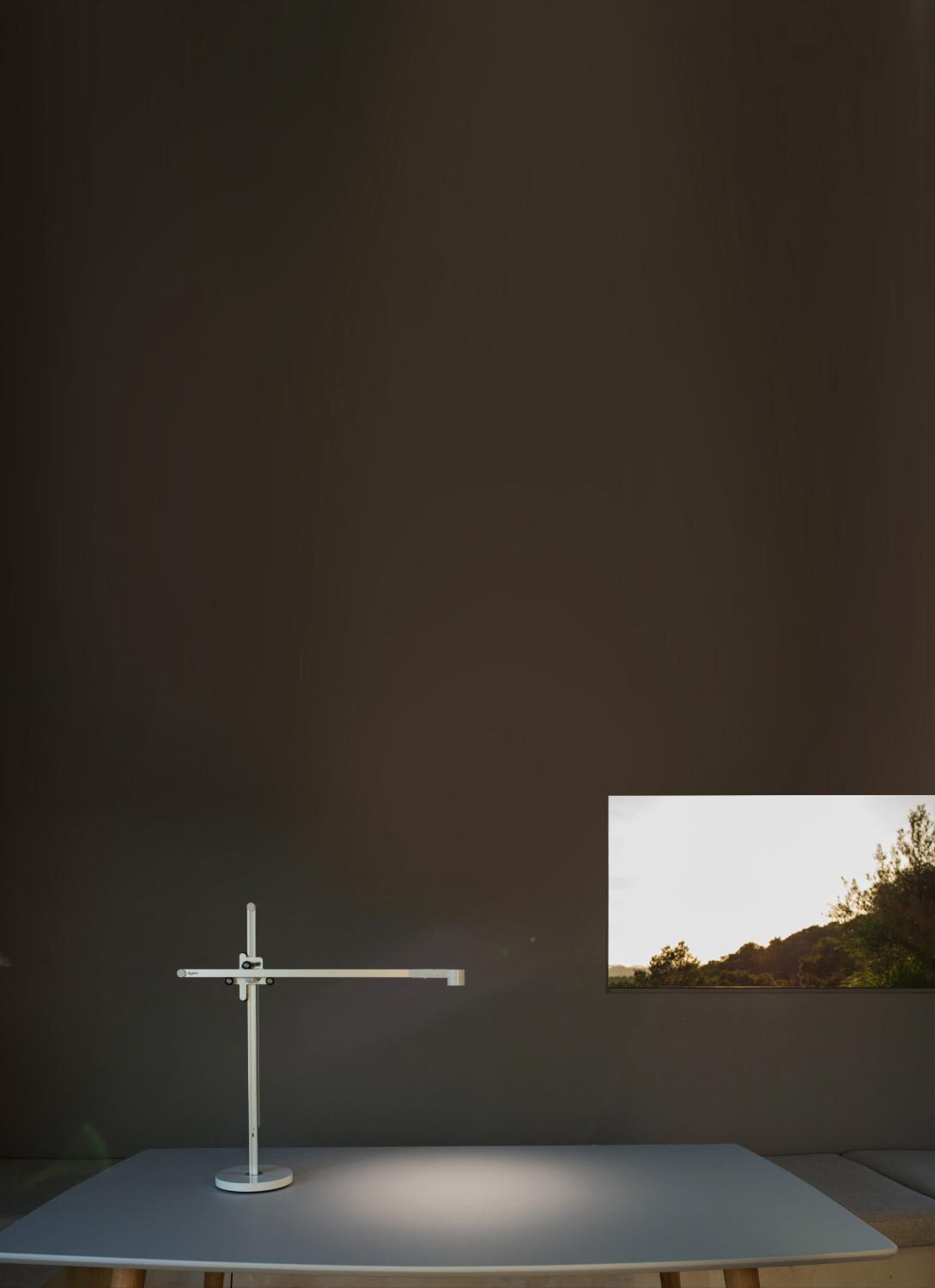 The Dyson Lightcycle™ task light adjusting with daylight outside a window